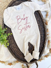 Load image into Gallery viewer, Long sleeve baby romper with pink embroidery that says "baby sister."