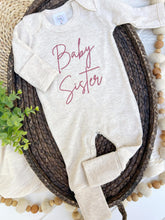 Load image into Gallery viewer, Long sleeve baby romper with pink embroidery that says "baby sister."