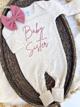 Load image into Gallery viewer, Long sleeve baby romper with pink embroidery that says "baby sister."