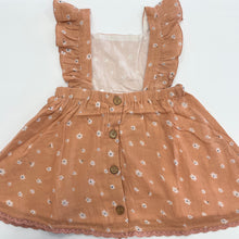 Load image into Gallery viewer, Peach colored girls dress. Adorned with back buttons, floral print and lace trim.