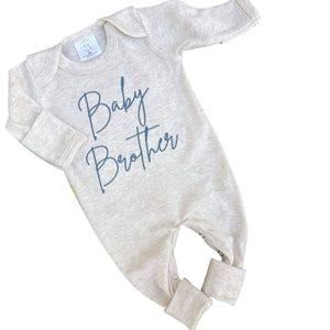 Long sleeve baby romper with blue embroidery that says "baby brother."