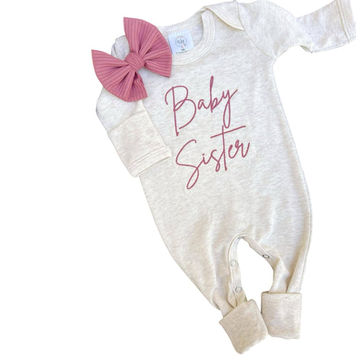 Long sleeve baby romper with pink embroidery that says 