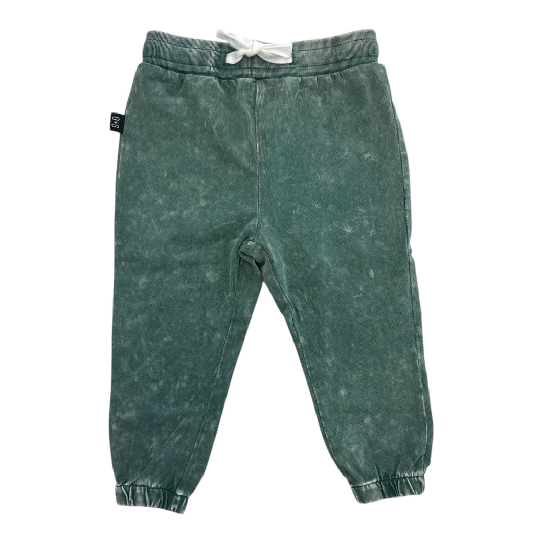 Distressed green jogger pants by Olive and Scout.