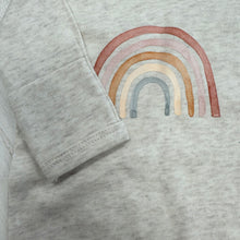 Load image into Gallery viewer, Light weathered oat baby romper with muted rainbow graphic on front, optional fold over hands and feet and snap closer. 