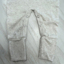 Load image into Gallery viewer, Light weathered oat baby romper with optional fold over hands and feet and snap closer. 