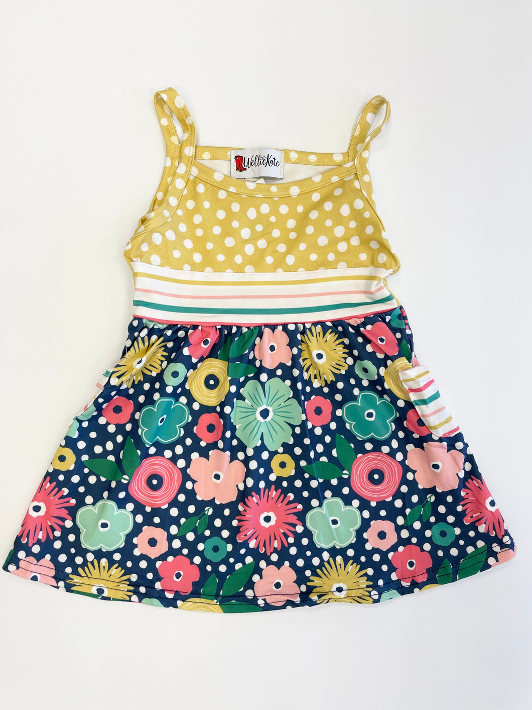 Girls' floral sun dress. Tank top straps, pockets and unique colorful pattern.