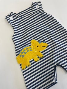 Blue and white striped one-piece romper with dinosaur patch.
