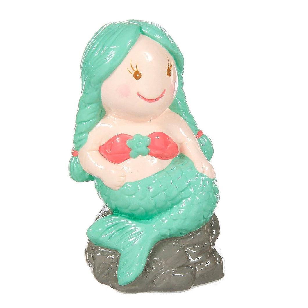 Mermaid sitting on a rock bank for kids.