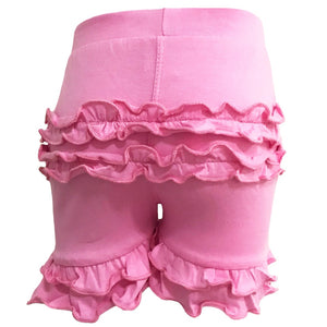Pink cotton toddler shorts with ruffles on butt and legs.
