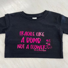 Load image into Gallery viewer, Black cotton girls tee shirt. Writing &quot;Fragile like a bomb not a flower.&quot;