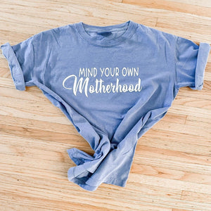 Mom tee shirt with saying, "Mind your own motherhood."