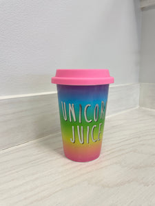 Vibrant ceramic cup with lid.