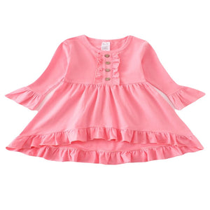 Pink girls dress with high-low hem, decorative buttons and ruffle details.