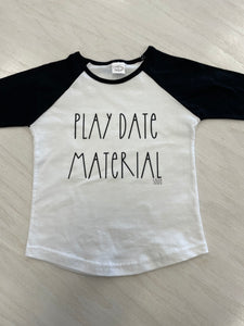 Black and white baseball style shirt with wording "play date material."