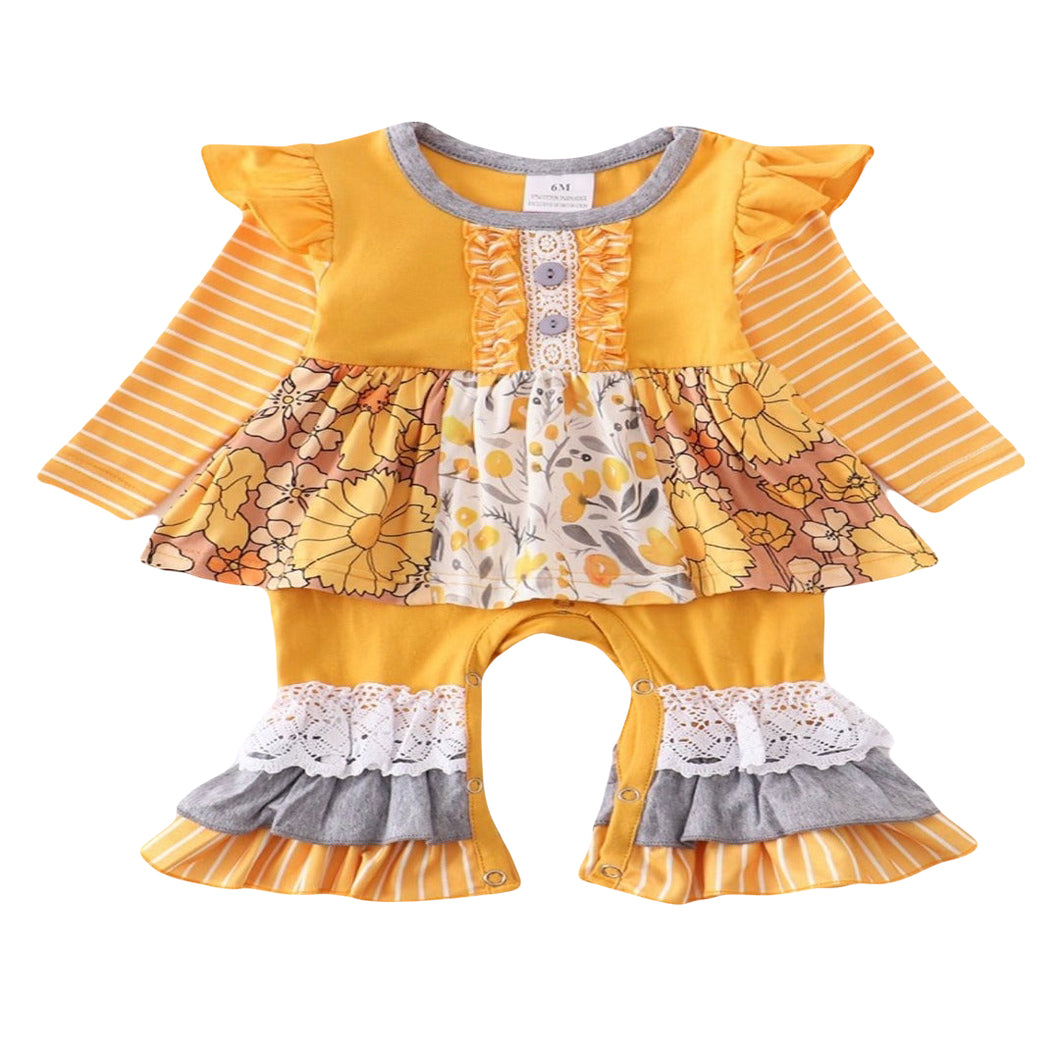 This yellow baby romper is burting with a vibrant yellow color and floral details. Long sleeves and flared legs make this a great option for any baby.