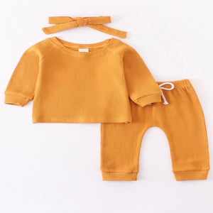 Waffle knit 3-piece baby set. Vibrant yellow color and head wrap set this outfit apart.