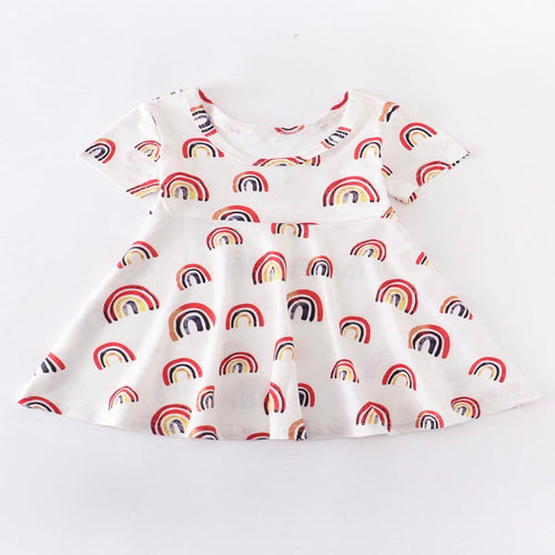 White a-line girls dress with bright rainbows.