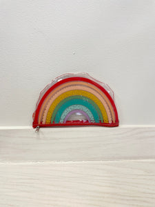 Pencil pouch shaped like a rainbow. 