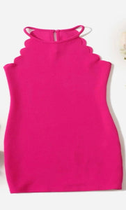 Vibrant pink girls dress. Featuring tank top racer back and scalloped design.