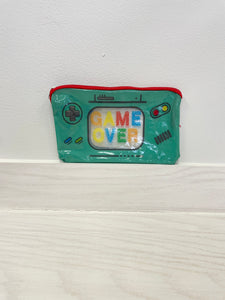Plastic pencil pouch that says, "game over" and looks like a video game controller. Zip closure. Great for back to school.