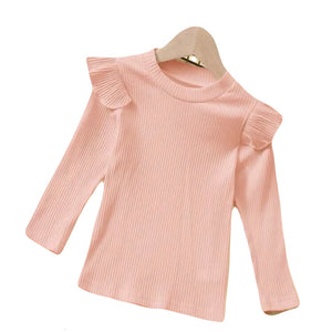 Pink ribbed long sleeve top with slight ruffle on shoulders.