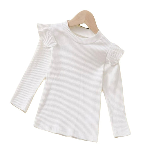 White ribbed long sleeve shirt with shoulder ruffles.